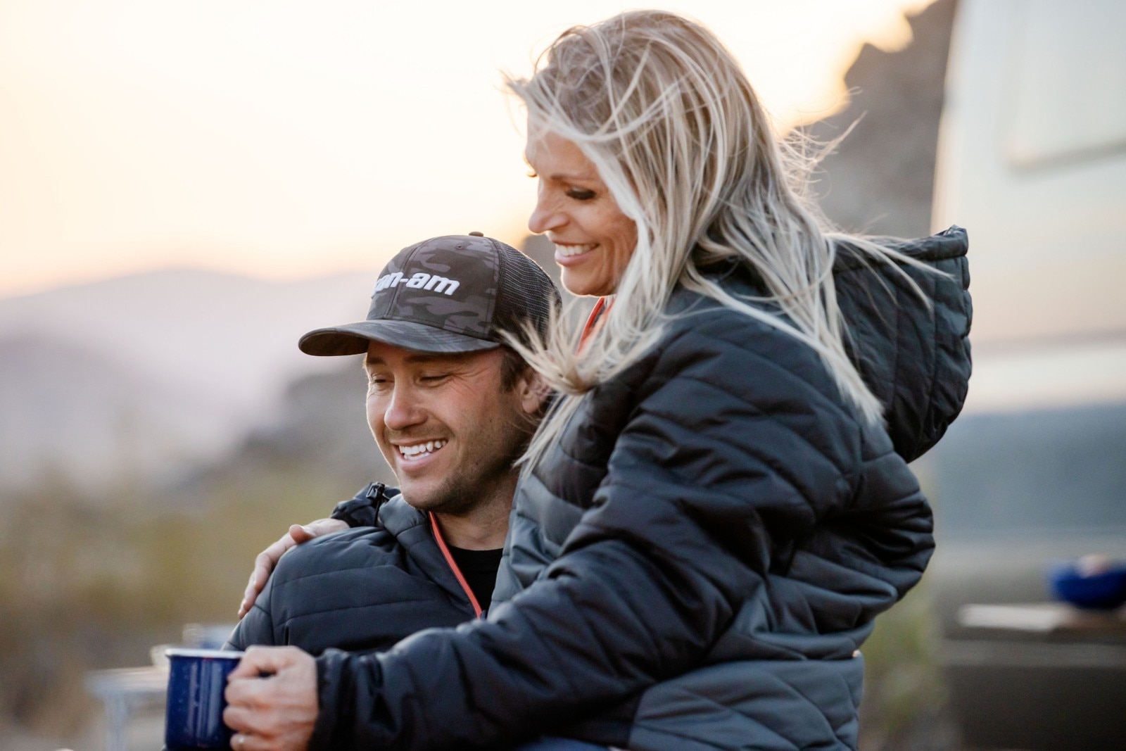 Couple smiling after a day of riding